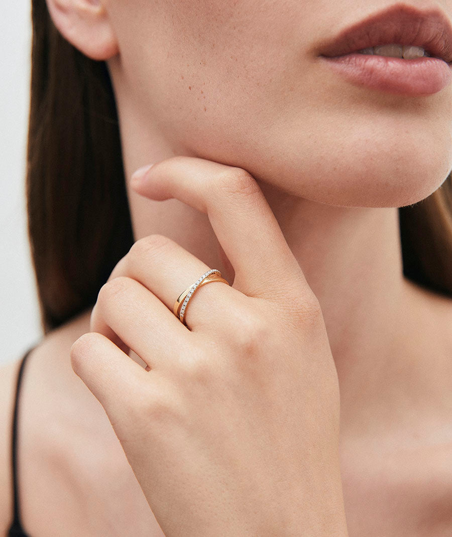 Intertwined diamond and gold ring
