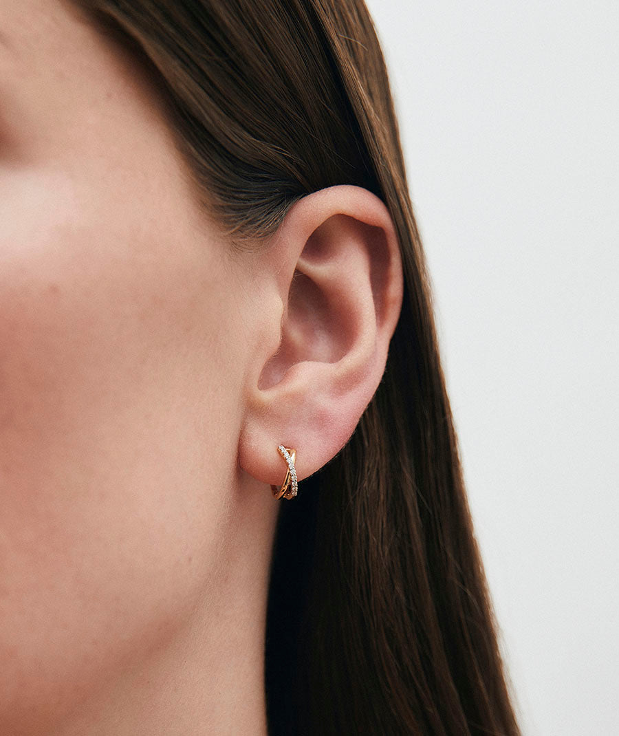 Intertwined diamond and gold earrings