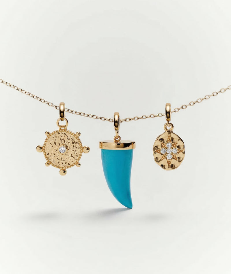 Charm N-S-E-O with white zirconia